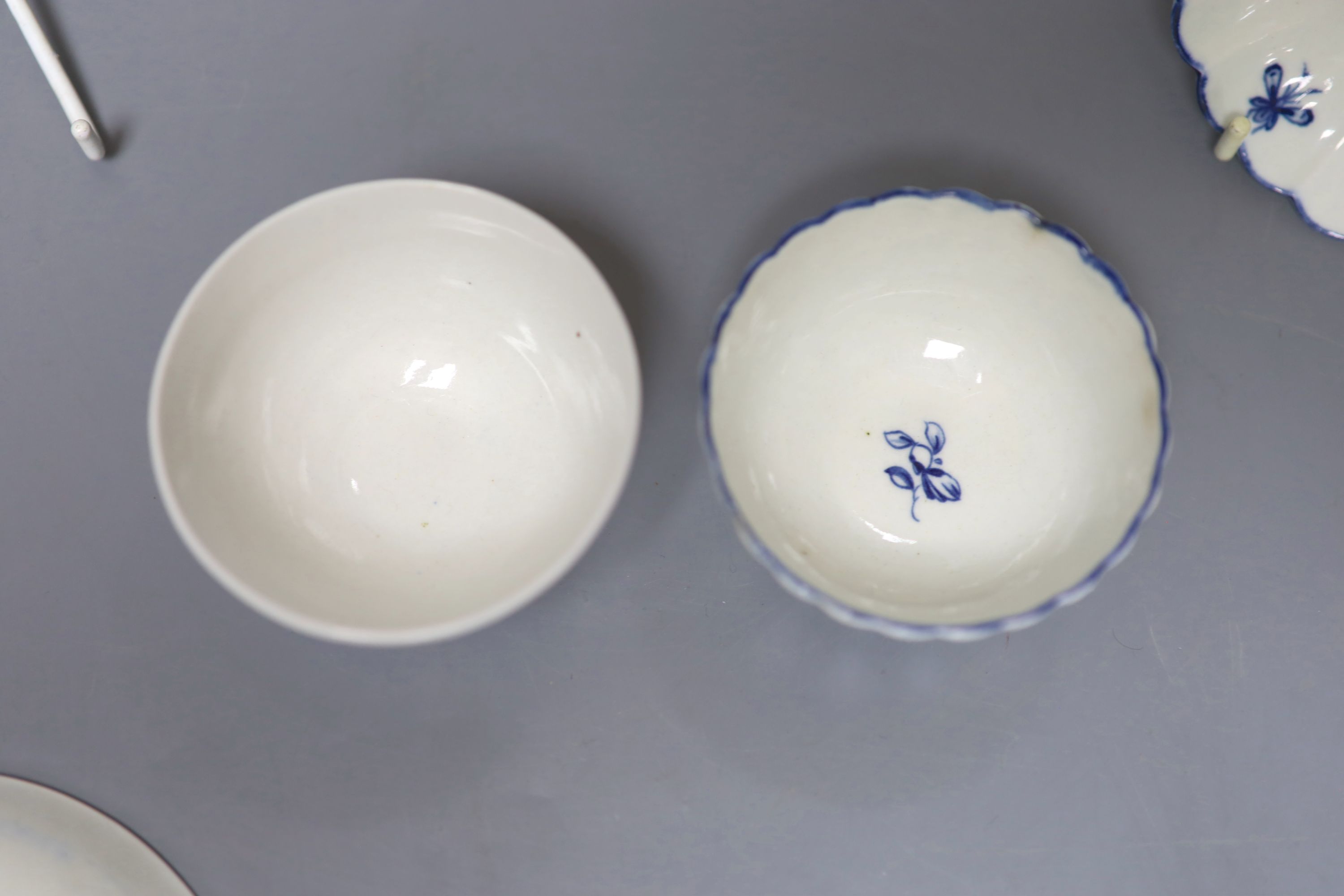 An 18th century Worcester fluted teabowl and saucer painted with the Gilliflower pattern and another teabowl and saucer with reed mould